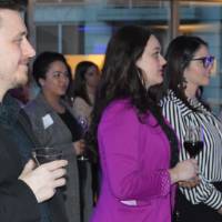 Alumni listening to T.Haas while enjoying their drinks